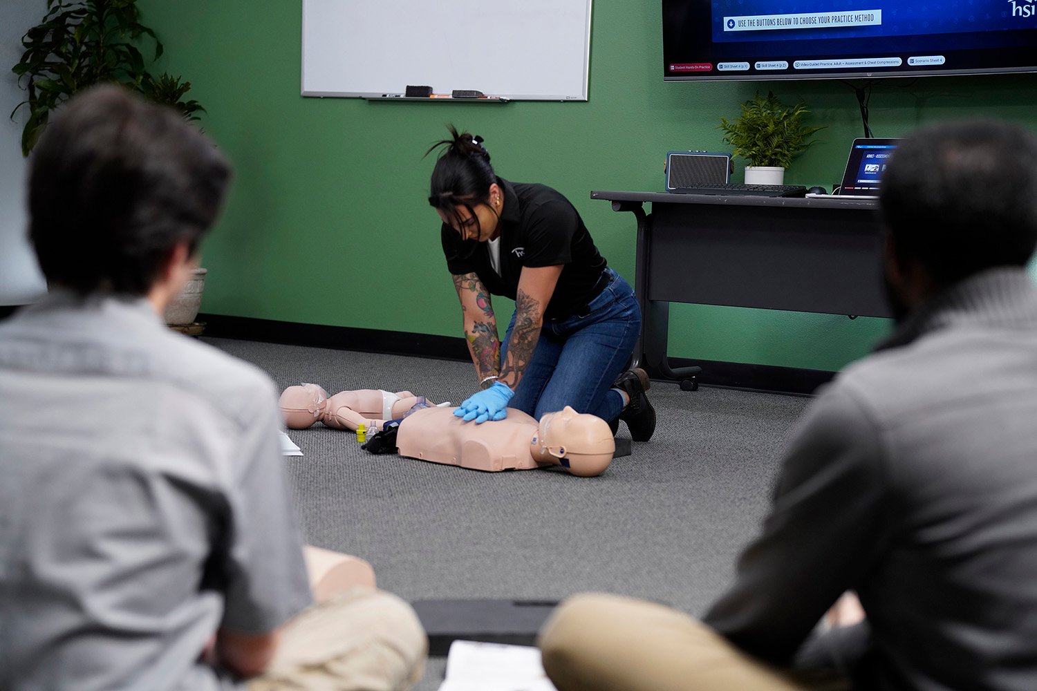 Instructor demoing CPR compressions_DSC2312